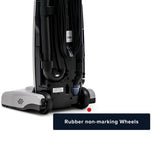 A close-up of the underside of a cordless vacuum cleaner, showing black rubber non-marking wheels and a dark base, with a text label reading 'Rubber non-marking Wheels' on a white background.